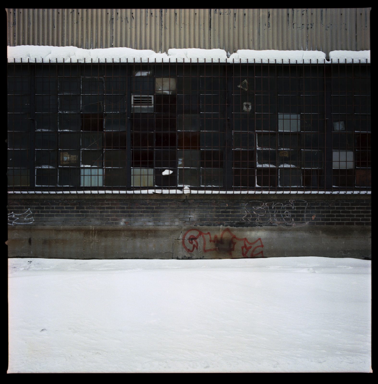 Factory windows at night, in winter. Detroit, Michigan.