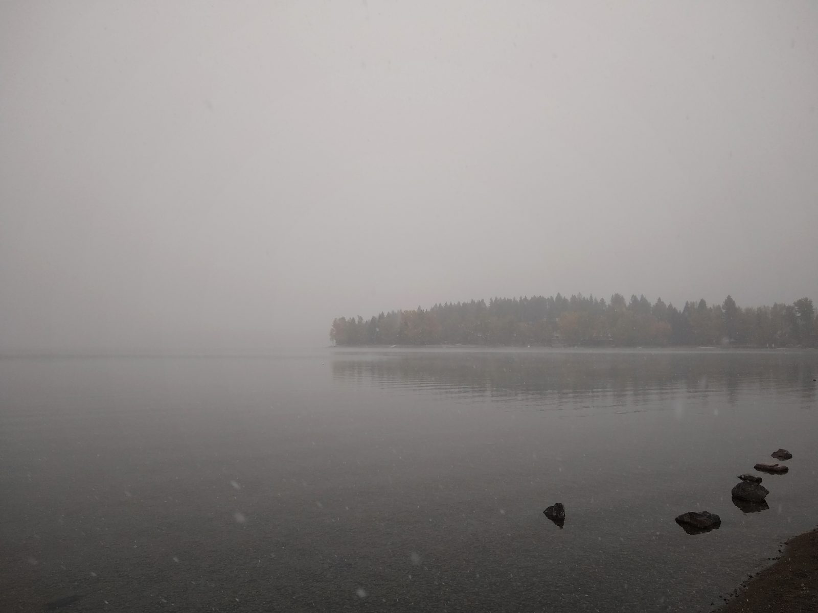 Snow, clouds, and Whitefish Lake