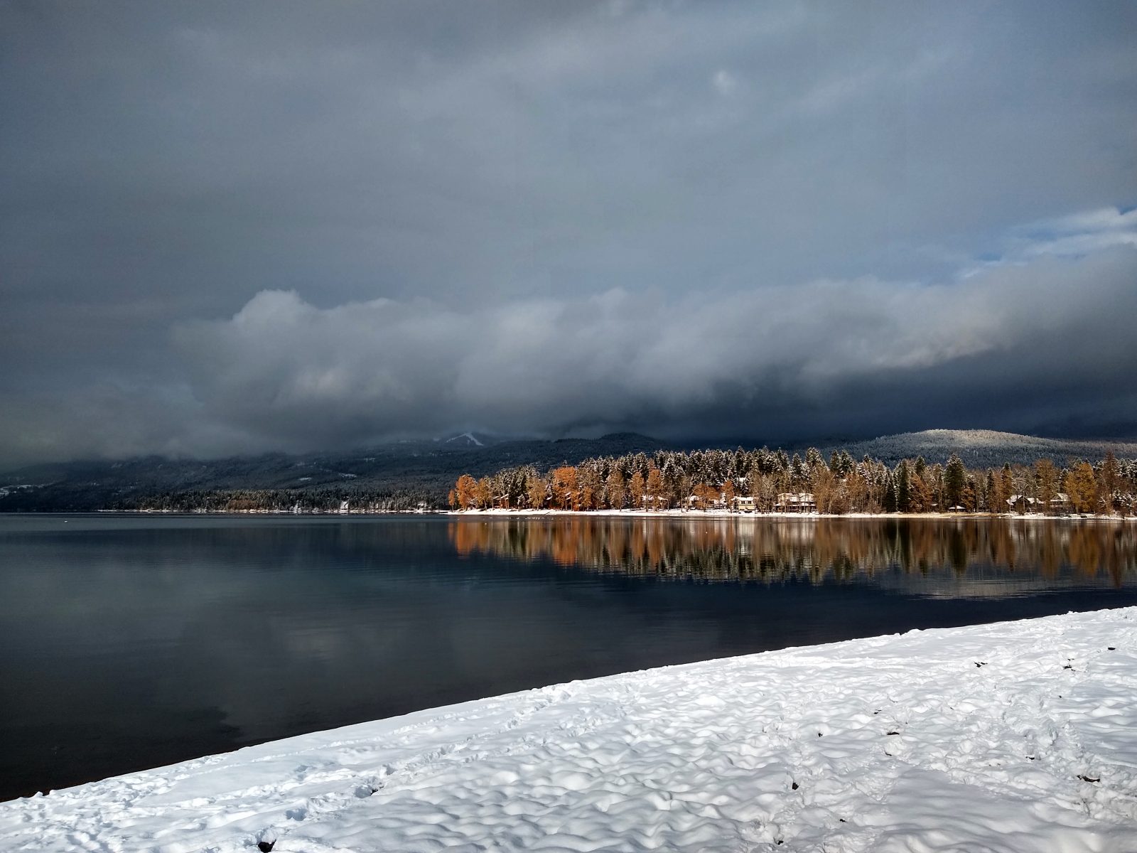 Snow, clouds, and Whitefish Lake